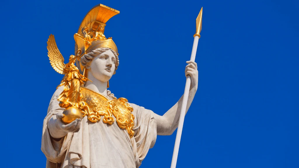 Decorative image of a statue of Athena holding a smaller statue, decorated with gold and holding a gold tipped spear