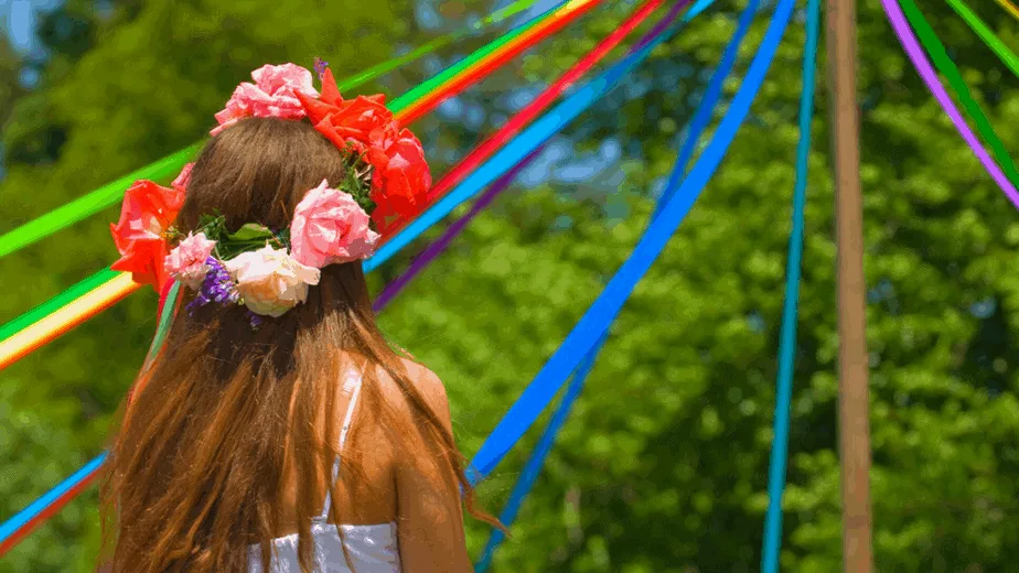 Decorative image of a girl looking at a maypole