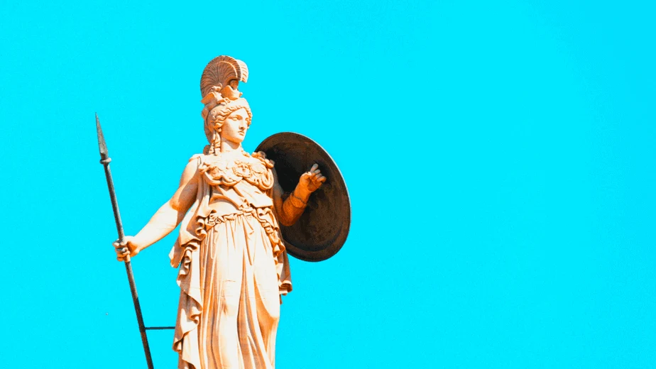 Decorative image of the goddess Athena against a blue background holding a shield and spear