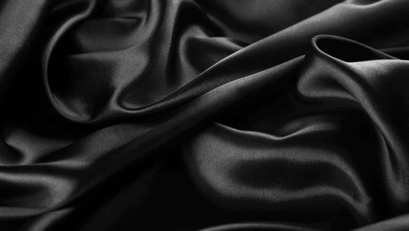 Decorative image of black satin. Why witches wear black.