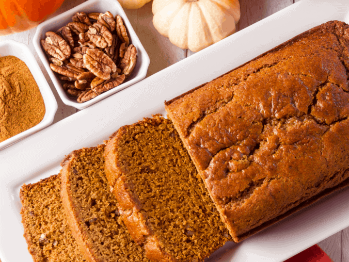 Decorative image of pumpkin bread with walnuts and pumpkins
