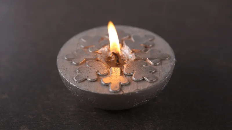 Decorative Image Of a silver snowflake candle