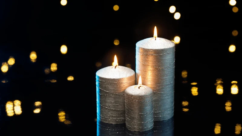 Decorative Image Of silver candles with bokeh background