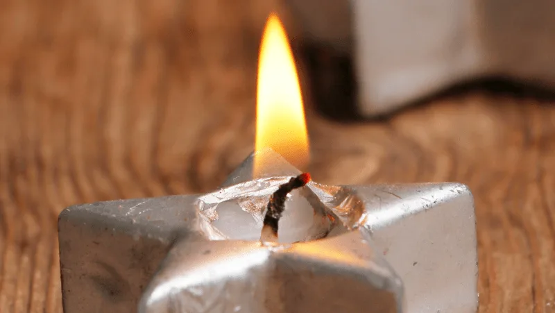 Decorative Image Of a silver star candle