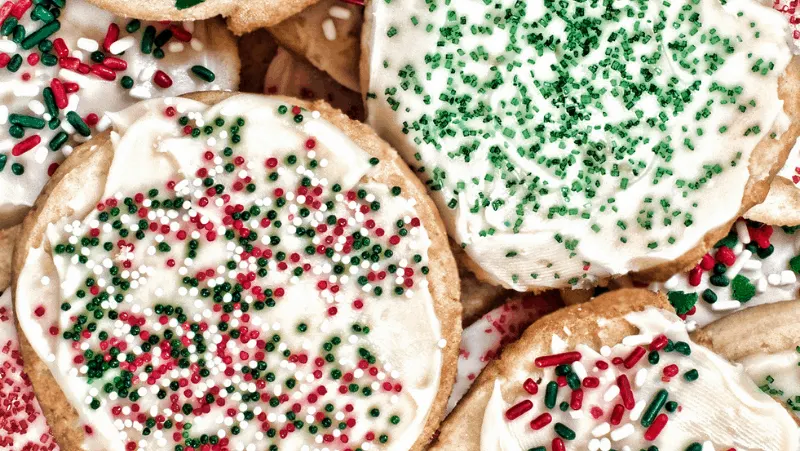 Sugar cookies decorated with sprinkles and icing.
