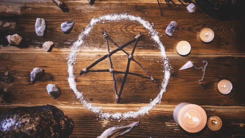 The Wiccan symbol of the pentagram and pentacle and a salt circle for protection
