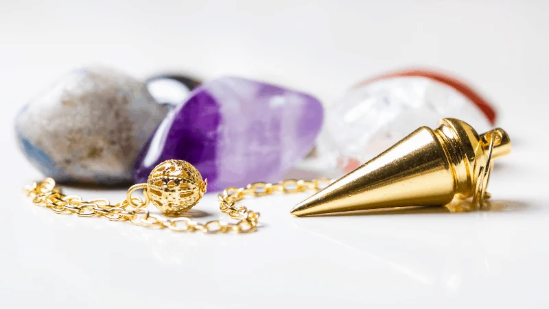 A golden pendulum and crystals