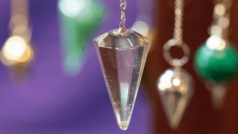 Many pendulums on a purple and brown background