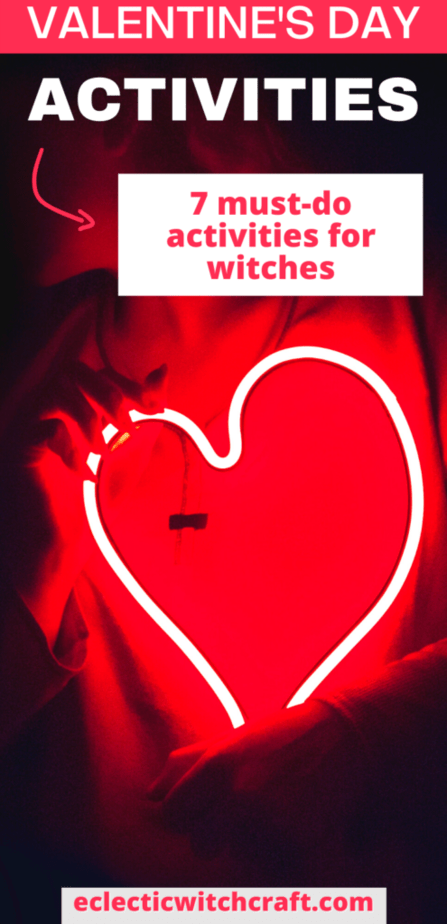Valentine's Day activities 7 must-do activities for witches. A woman in a dark room holding a neon heart.
