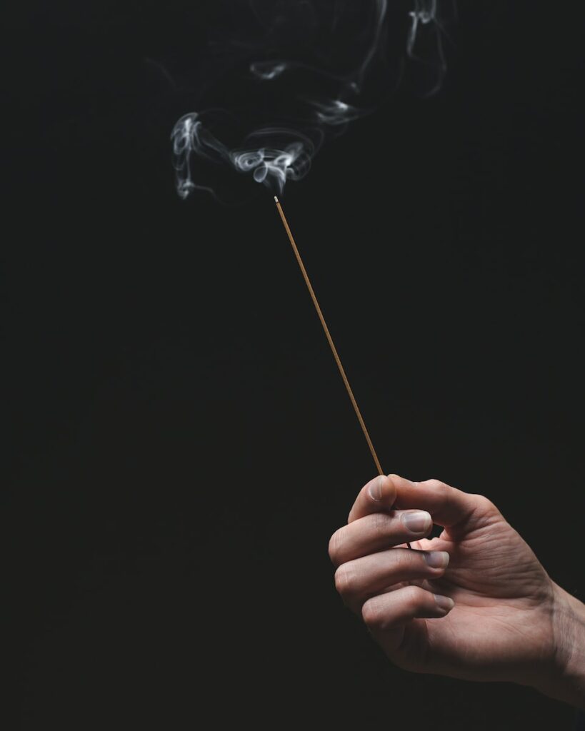 person holding a white smoke