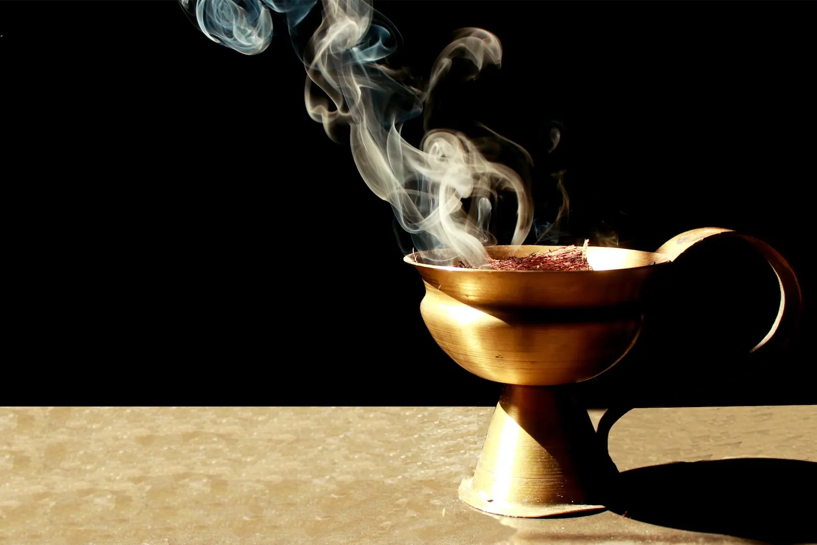 brown ceramic cup with smoke