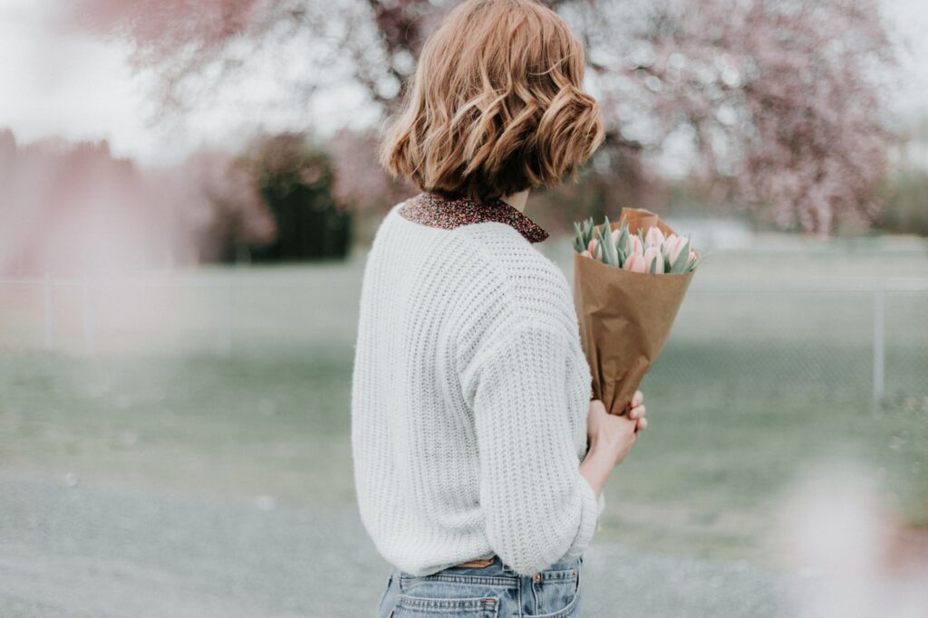 woman holding flower bouquet