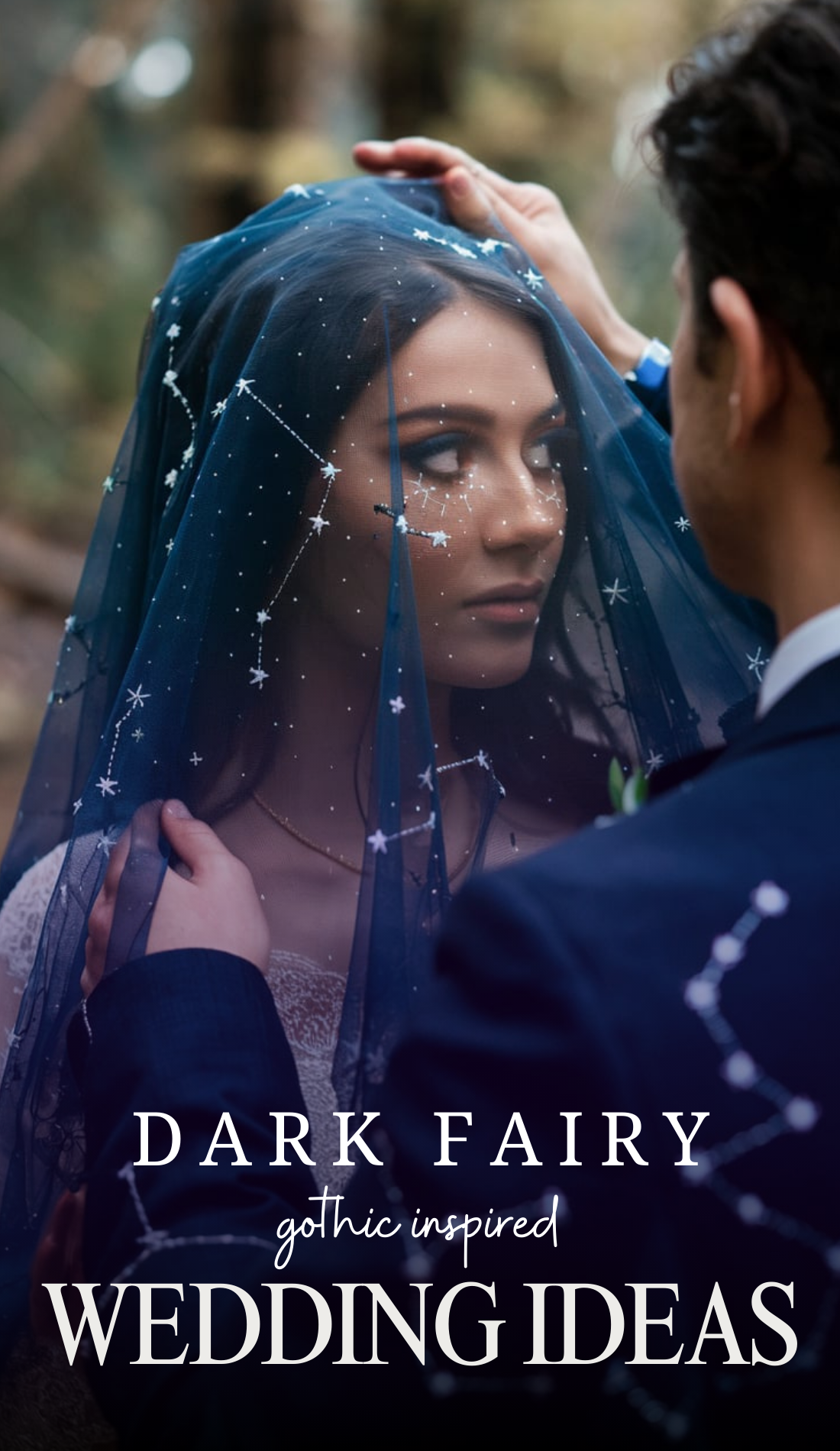 A bride wrapped in deep blue mystery stands beneath a soft forest light, her veil shimmering with delicate embroidered stars. Her groom lifts the veil with reverence, revealing her celestial beauty. The intricate details of the veil catch the light, symbolizing the merging of cosmic fate and earthly devotion.