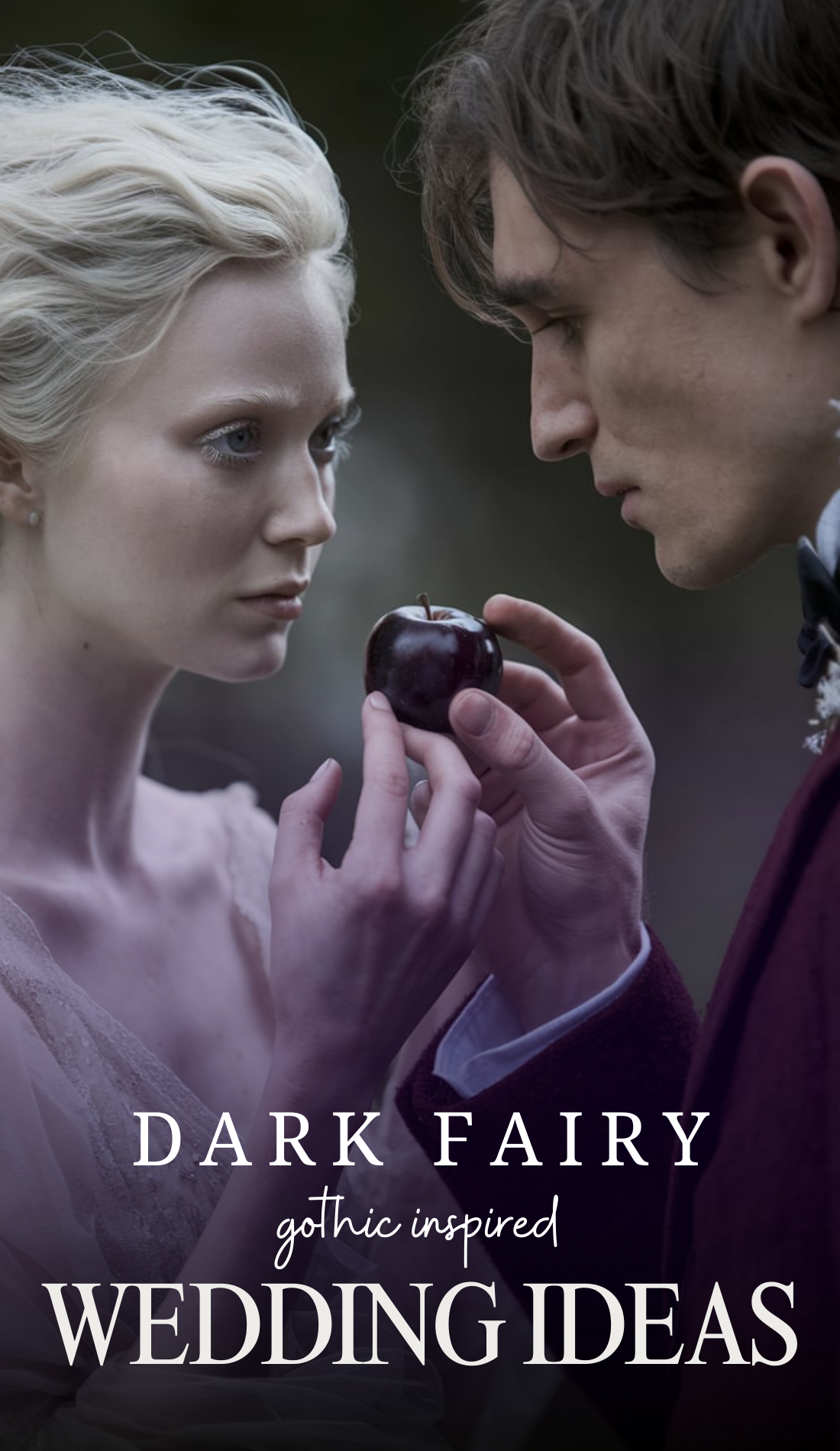 A delicate, ethereal bride with pale skin and soft, fae-like features gazes intently at a glossy black apple held between her fingertips and her groom’s hand. The groom, dressed in deep burgundy, leans in with an intense, almost hypnotic expression. The background is blurred, creating a dreamlike atmosphere, evoking dark fairy tale romance.