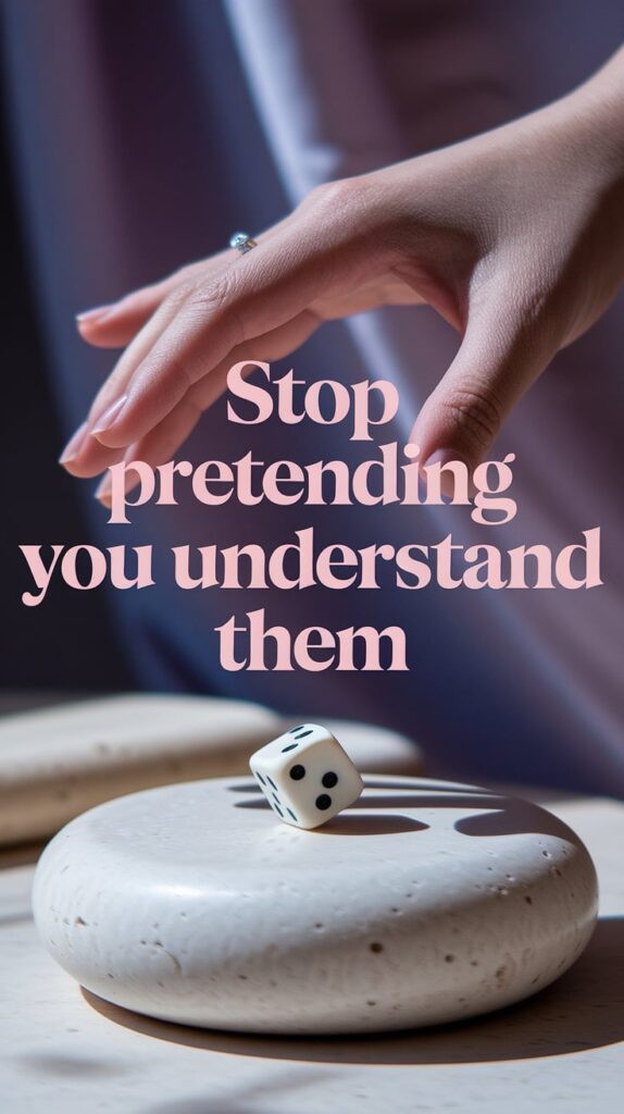 Close-up of a hand hovering above an astrology dice roll on a smooth, pale stone table. The dice are mid-movement, slightly blurred to imply motion. Soft lavender shadows curve around the hand, and everything else is out of focus. Text is deep blush pink, large and centered, over the dice—daring the viewer to admit what they don’t know.