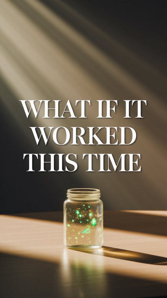 Background is a pale wood table with diffused golden morning light falling across it. A single, simple jar sits in the center, contents glowing faintly green and gold. Text is dramatic in warm gold serif, very large, centered beneath the jar. The whole image is designed to feel like a private moment of transformation.